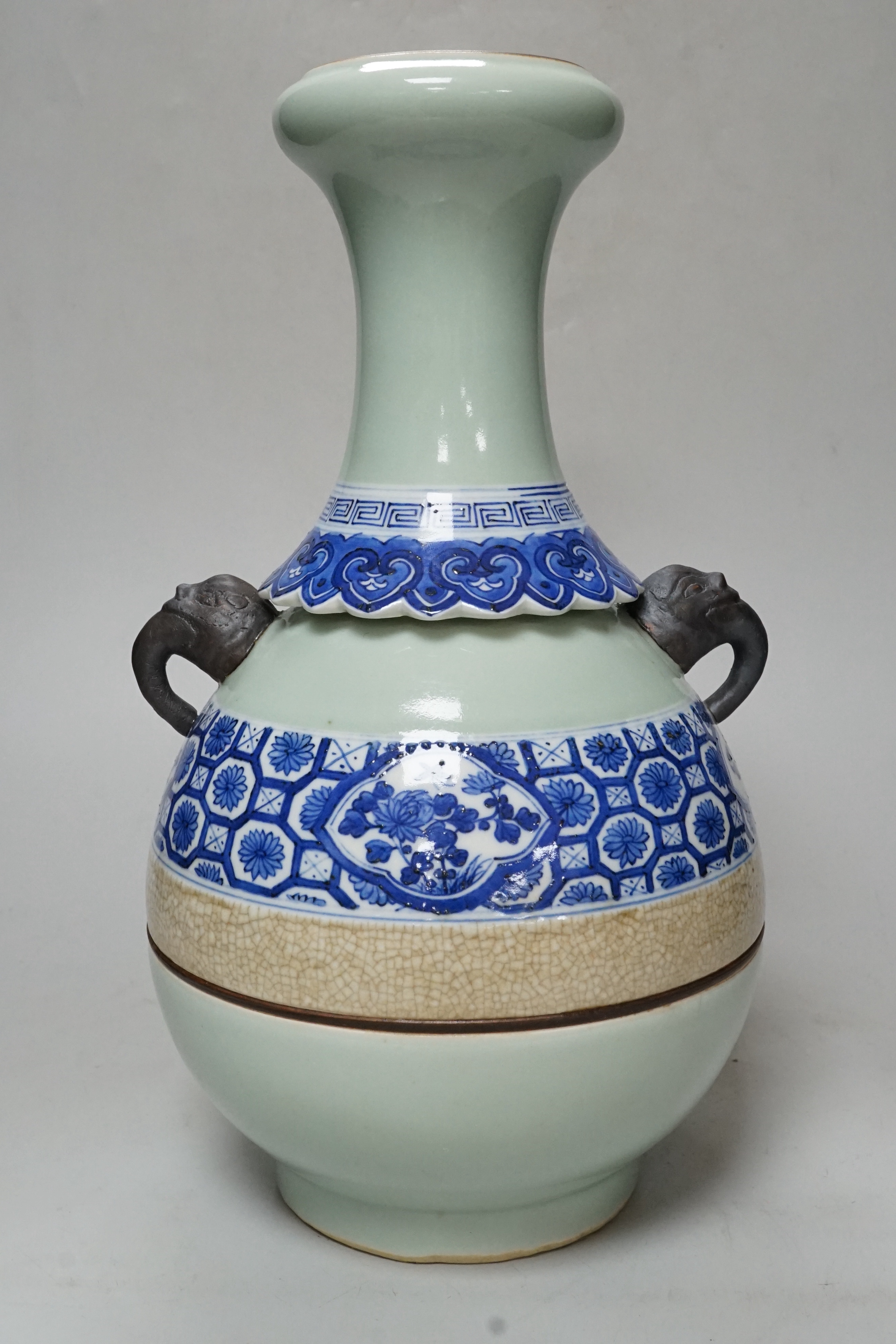 A Chinese celadon and underglaze blue two handled vase, 33cm tall